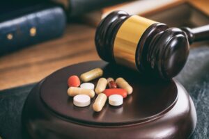 judge-gavel-and-drugs-on-a-wooden-desk-2021-08-26-16-34-03-utc.jpeg