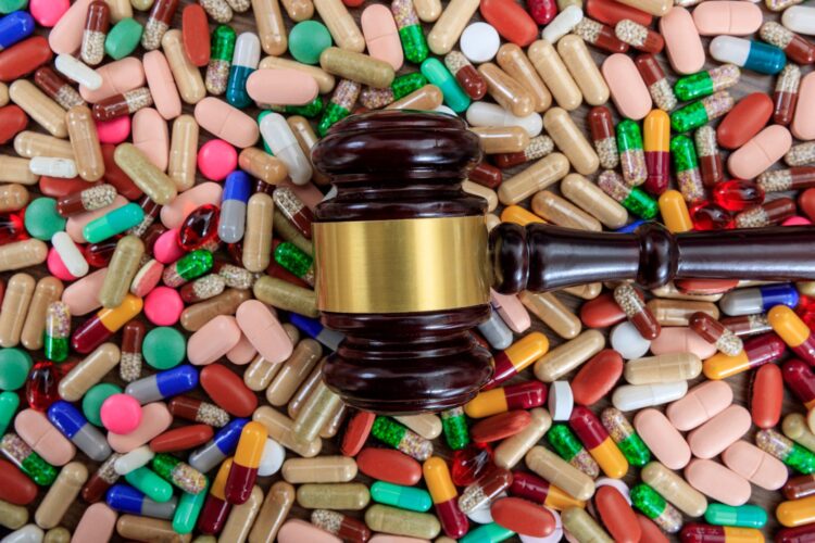 judge-gavel-on-drugs-background-P9CJK27.jpg